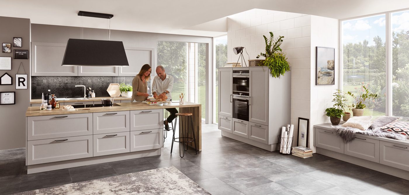 Stone grey shaker kitchen with oak worktop and breakfast bar