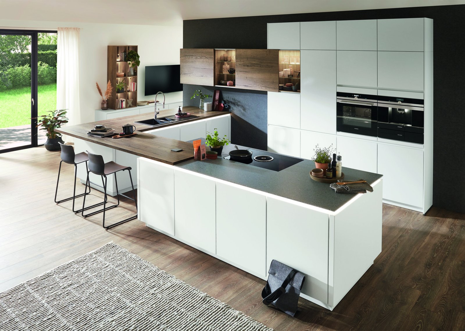 Handleless German-style kitchen in graphite and grey with a quartz worktop
